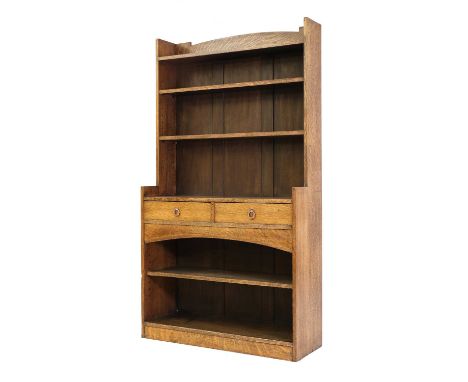 An Arts and Crafts oak open bookcase,with two adjustable shelves, over two drawers and a further adjustable shelf below, 101.