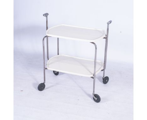 On trend collapsible double shelf, white plastic shelves supported on metal frame, and castor wheels, with unique walking sti