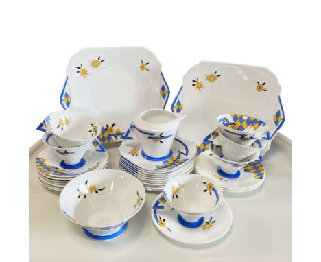 Comprising: A milk jug, a sugar bowl, 5 tea cups, 11 saucers, 11 cake plates, 2 large cake serving plates(31)