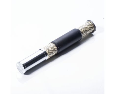 Model L, made in England by Carbic Ltd., London 1921-1972 This cylindrical slide rule consists of a chromium-plated holder, a