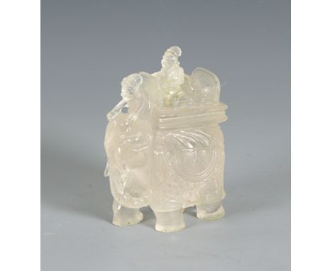 A large rock crystal elephant with mahout and Maharaja, 19th century AD.A large rock crystal elephant, trunk curling round to