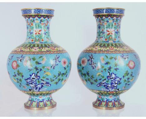 A Pair of Chinese cloisonné enamel turquoise-ground vases19th century清十九世紀   掐絲琺瑯花鳥紋瓶一對Each vase is decorated with a central 