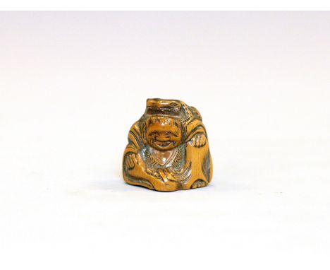 A wood Netsuke of Gama SenningJapan, 19th centuryCarved in seated position wearing long robes and carrying a toad on his head