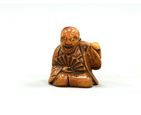 A wood Netsuke of a Samurai, by ShogyukuJapan, Edo period (1603-1868) First half 19th centuryCarved in a kneeling position, h