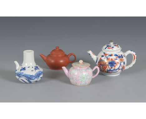 A group of four Chinese teapotsChina 18th century and laterConsisting of a Yixing, Imari and Famille rose teapots and a blue 