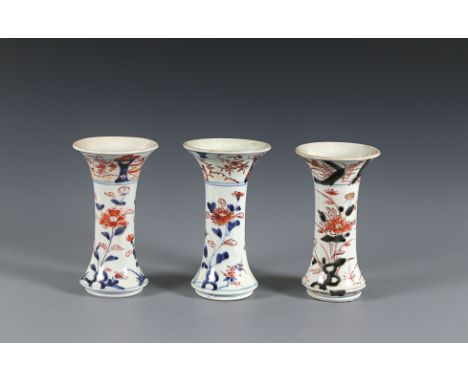 Three Imari beaker vasesJapan, Arita Late 17th centurydecorated in underglaze blue, iron red enamel and a gold, depicting peo