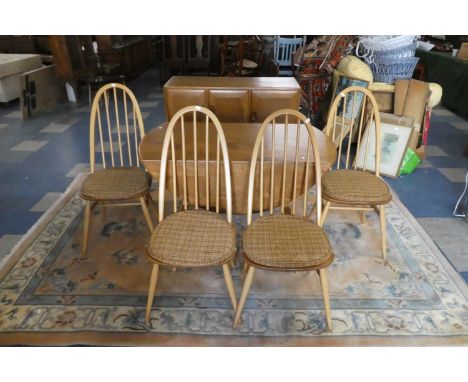 An Ercol Blonde Elm Quaker Dining Room Suite Comprising Drop Leaf Table, Four Hoop Back Chairs and Sideboard with Cupboards a