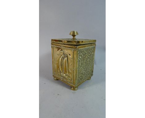 An Edwardian Brass Rectangular Tea Caddy with Pressed Decoration Depicting Islamic Panels and Fishing Barge, 17cm High 