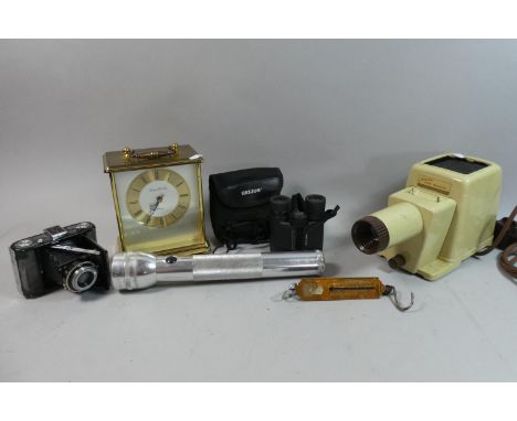 A Tray Containing Helios Binoculars, Vintage Camera, Carriage Clock, Torch, Slide Projector etc 