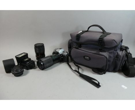 A Minolta X300 Camera with Telephoto Lens, Bag and Accessories 