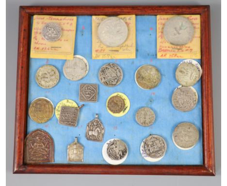 A group of Indian silver and base metal temple tokens or charms, 19th/20th century, tray 6CONDITION: Provenance - Alfred Theo