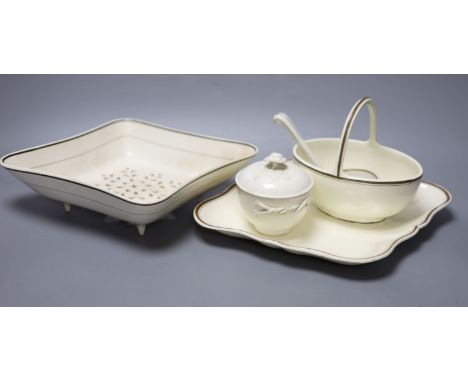 A group of Wedgwood creamware, first half 19th century - a lozenge strainer, similar dish, a cream basket and ladle and a lat