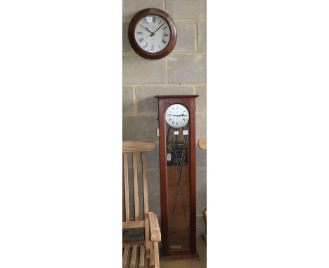 A Synchronome electric master clock in an oak case, Dial 35cm diameter, H.129cm, together with a similar circular slave clock
