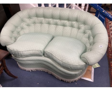 A tub framed two seater settee upholstered in patterned pale green fabric, length 150cm, depth 80cm, height 78cmCONDITION: On