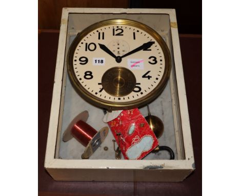 A Brillie cream painted zinc and white marble clocking on/clocking off pendulum clock, H.43.5cm., Dial 26cm diameter, lacking