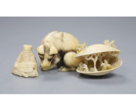 An 18th/19th century Japanese ivory netsuke, in the form of a seated wolf, signed to underside, 3.5 cm high, 5 cm wide, toget