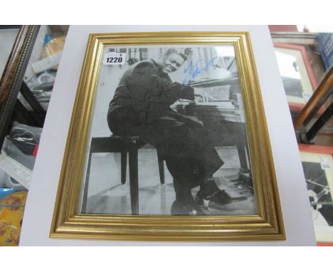 Fats Domino Autograph, blue pen signed on a black and white image of him playing the piano, unverified.