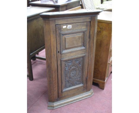 Early XX Century Oak Corner Wall Cupboard, with carved lower panel to single door, 80.5cm high.