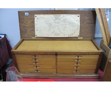 Oak Specimen Box, with lift up lid, front panel concealing two banks, each of five drawers, containing many dried plants, lea