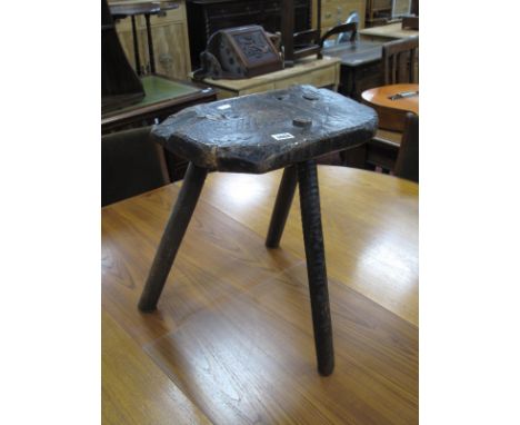 XIX Century Cutlers Stool, with shaped seat in tripod legs, 46cm high.