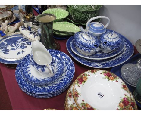 Matlock Dinner Ware, pail oval tureens, Willow Pattern meat plates and teapot, etc, approximately seventeen pieces.