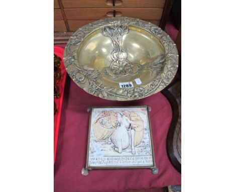 Arts and Crafts Brass Fruit Bowl, embossed with stylised flowers on three spread eagle supports and paw feet, 28.5cm diameter