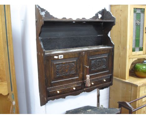 Late XIX Century Oak Wall Rack, having single shelf over carved doors 'AFB 1899' and twin doors, 60.5cm wide.