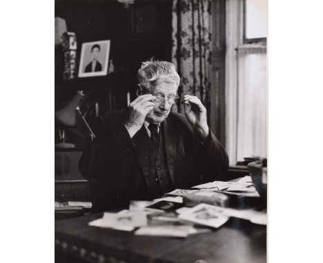 L.S. Lowry R.A. (British 1887-1976) at his home in Mottram, photograph. L.S. Lowry R.A. (British 1887-1976) at his home in Mo