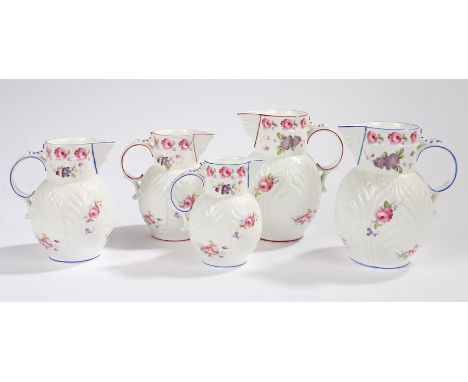 Coalport The Caughley Mask-Head jug, to include a trio with blue edging and flower decoration, together with a pair in red wi