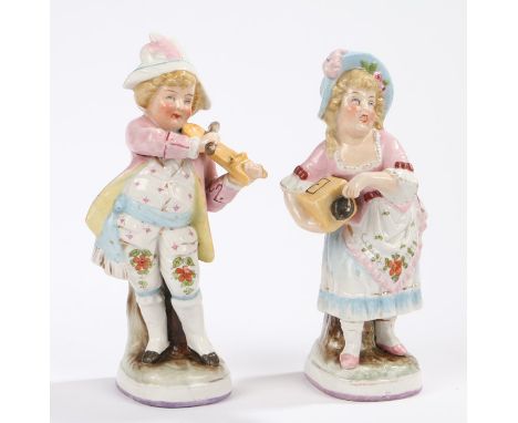 Pair of Continental porcelain figures, depicting a boy and a girl playing with instruments, 17cm high (2)
