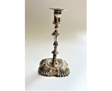 An Edwardian Sterling Silver Taper stick. In George III style. London 1904. loaded. 14cm high. 