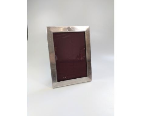 A silver Birmingham 1944 photo frame with engine engraved design size 11.5cm x 17cm 