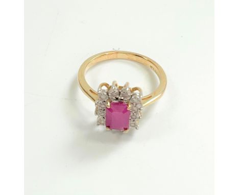 9ct yellow golf step-cut emerald-cut ruby and Round Cut Diamond ring. Ruby 1.51ct