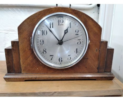 A 1930's walnut cased mantel clock. 