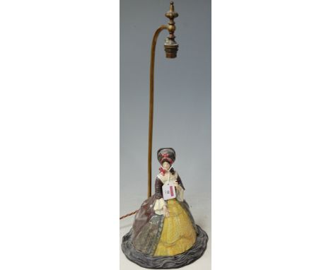 A lacquered brass table lamp **surmounted by a Royal Doulton figure Lady of the Georgian period ** Condition Report / Extra I