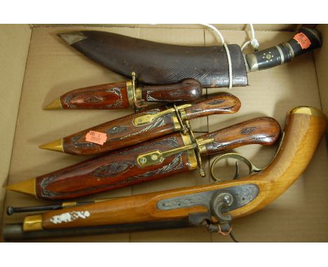 A replica percussion pistol; together with kukri in leather scabbard; and three decorative daggers (5)