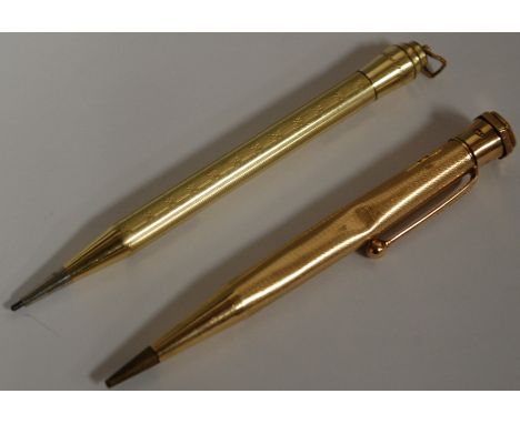 An engine turned 9ct gold propelling pencil; and a rolled gold example (2)
