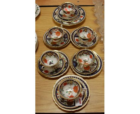 A Shelley Ashworth pattern part tea set comprising six cups, saucers, and teaplates, pair of cake plates, all heightened in g