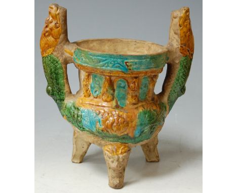 A Chinese tile works sensor with cauldron body on tripod base and glazed in shades of green, amber and turquoise