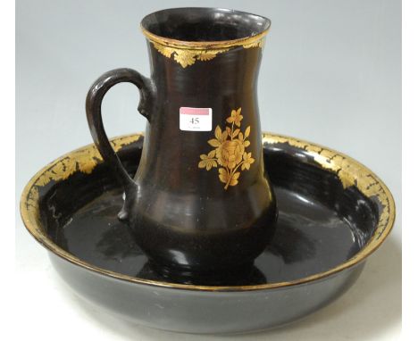 A black lacquered and gilded papiermache two-piece jug and bowl set Condition Report / Extra Information Not on ceramic body.