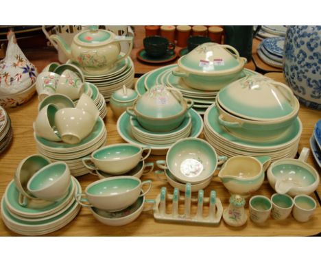 An extensive Susie Cooper Crownworks Burslem tea and dinner service, to include; graduated meat plates, tureens and covers, t