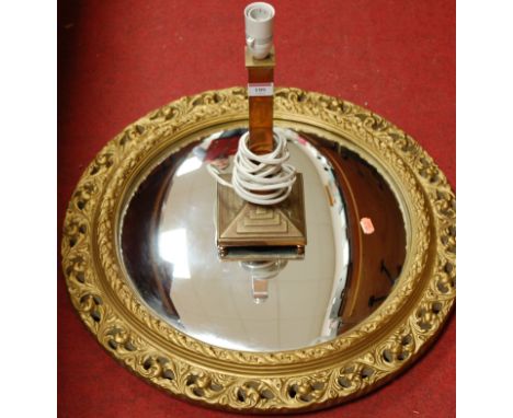 A gilt framed convex wall mirror, and a lacquer brass table lamp (2)