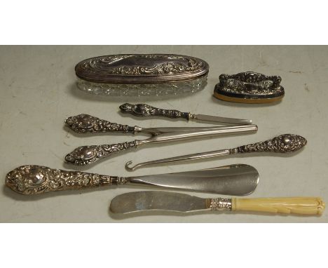 A collection of assorted late Victorian silver mounted ladies dressing table wares to include; nail buffer, shoe horn, button