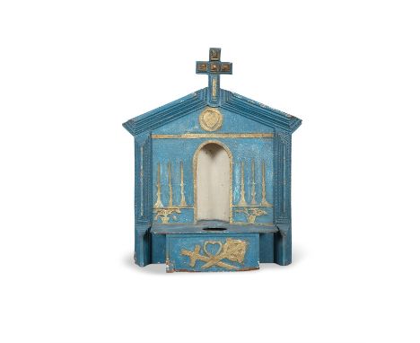 A BLUE AND GOLD PAINTED SHRINE, the stepped carved columns enclosing, a central niche with shelf. 51 x 62cm high