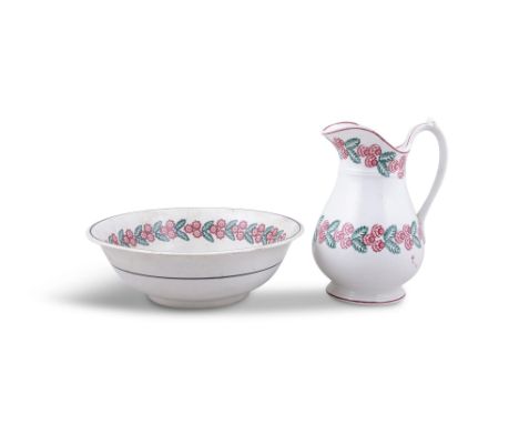 A 19TH CENTURY SPONGEWARE JUG &amp; BASIN, the off white ground decorated with red and green leaves and flowers. 33 x 27cm hi