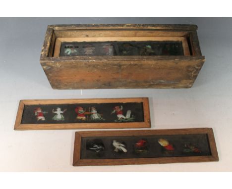 A COLLECTION OF TWELVE HAND PAINTED 19TH CENTURY MAGIC LANTERN SLIDES, various subjects including Mr. Punch etc.Buyers - for 