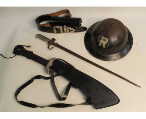 A 1939 BRODIE HELMET, black painted with worn 'R' decal badge to the front, along with a French bayonet, Chinese type cleaver