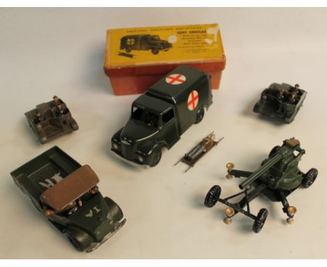 A BOXED BRITAINS DIECAST METAL ARMY AMBULANCE, set no. 1512, with driver, stretcher and wounded man, together with a Beetle L