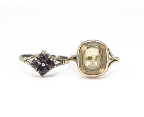 A 9ct gold and citrine dress ring, the cushion shaped citrine in rubbed over setting, ring size M, gold weight 2.2g, together