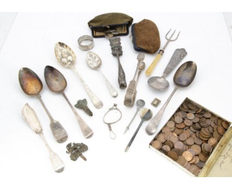 A collection of silver and silver plate and coins, including a silver berry tablespoon, a tablespoon, sugar tongs, napkin rin